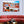 Tableau mural représentant Lisbonne et ses façades colorées, ses toits de tuiles rouges et son architecture lumineuse sous un ciel bleu