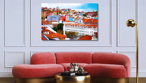 Tableau mural représentant Lisbonne et ses façades colorées, ses toits de tuiles rouges et son architecture lumineuse sous un ciel bleu