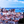 Tableau mural représentant Lisbonne avec ses toits rouges, ses façades blanches et une vue sur le Tage avec bateau à l’horizon