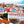 Tableau mural représentant Lisbonne et ses façades colorées, ses toits de tuiles rouges et son architecture lumineuse sous un ciel bleu
