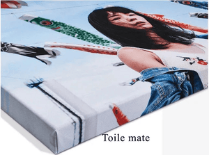 matte canvas print featuring a woman outdoors with colorful koi flags in the background