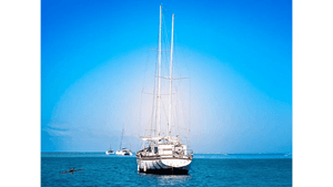 sailboats anchored on calm blue sea under clear sky, nautical photography art