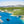 -Tableau  déco mural représentant une baie méditerranéenne aux eaux bleu profond, entourée de falaises verdoyantes, avec voiliers et bateaux au mouillage - Sérénité marine - Plexiglas - ESPOIR PHOTOS